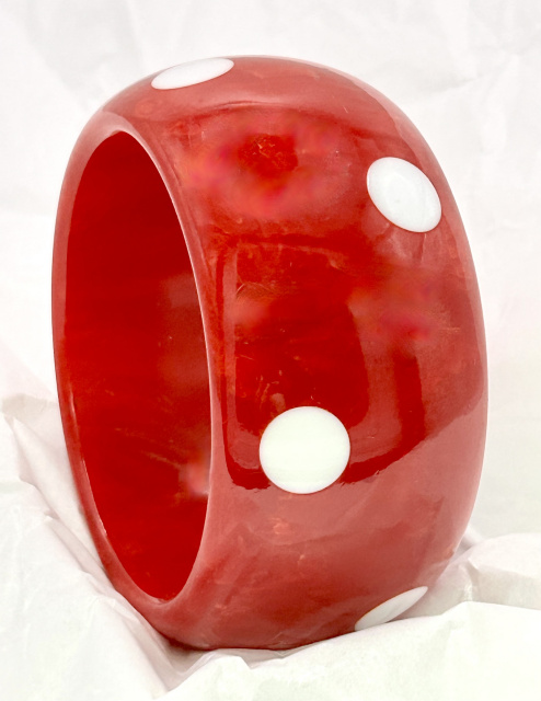 vintage marbled strawberry red wide and chunky bakelite bangle with white lucite up and down dots